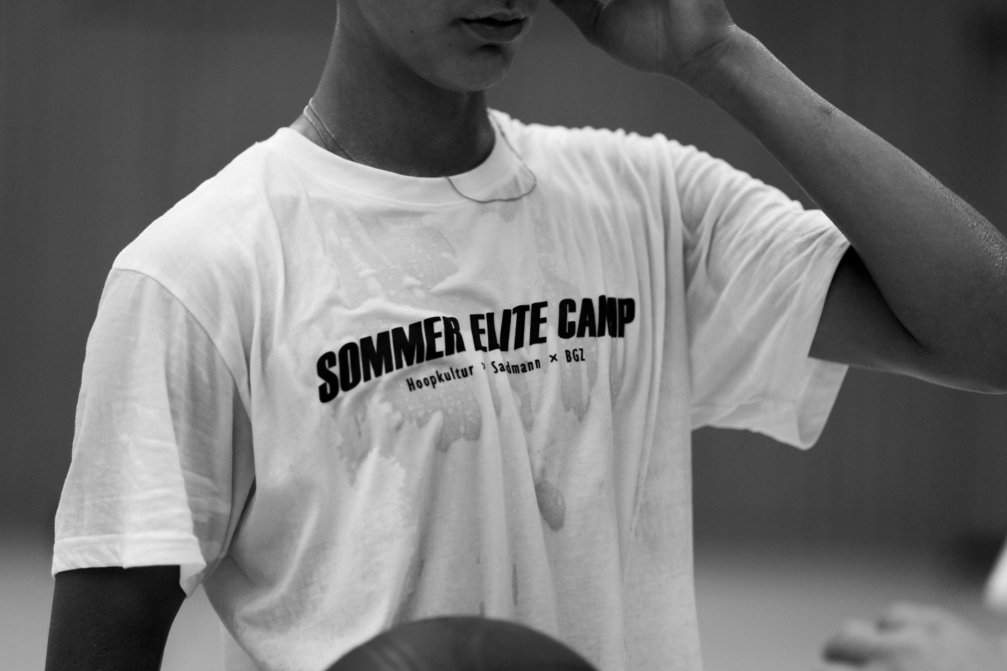 Black-and-white close-up of a sweaty Sommer Elite Camp shirt after training
